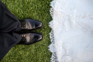 bride and groom's feet face each other as they take on chronic illness
